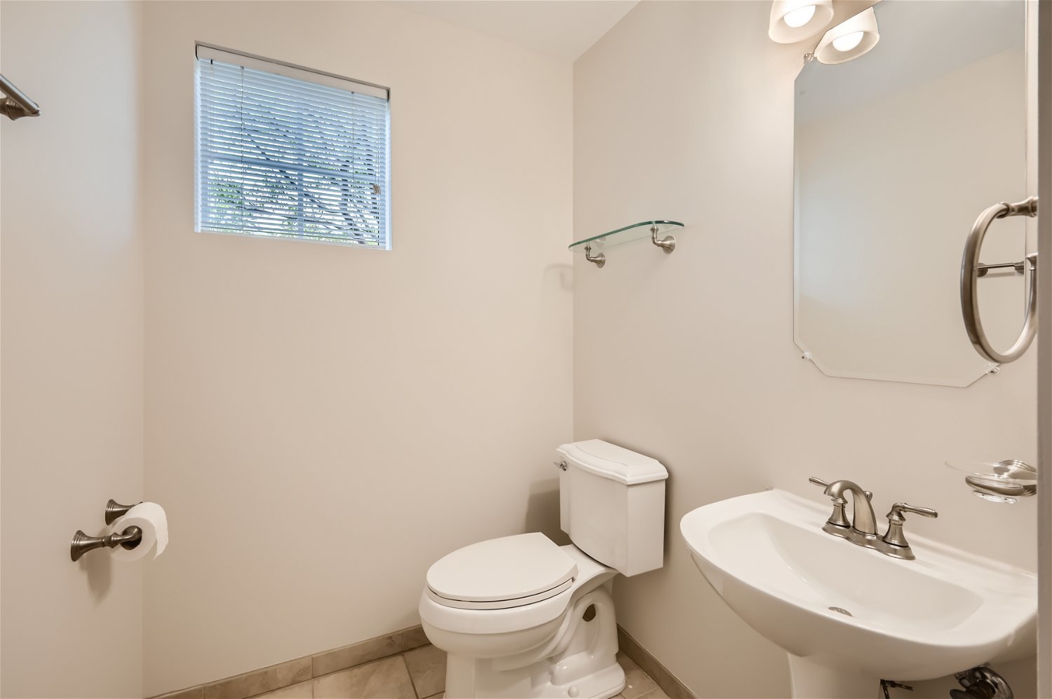 1 Charlotte Circle Elmhurst, IL 60126 - Photo 5 of 11 a bathroom with a toilet sink and mirror