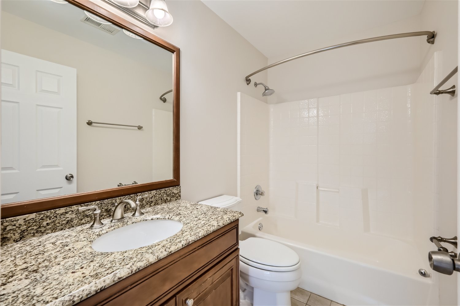 1 Charlotte Circle Elmhurst, IL 60126 - Photo 7 of 11 a bathroom with a granite countertop sink a toilet and a mirror