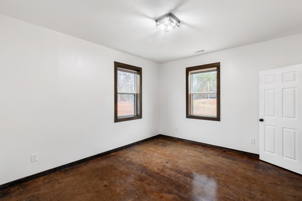 620 A Stiles Road Epworth, GA 30541 - Photo 11 of 21 a view of an empty room with a window