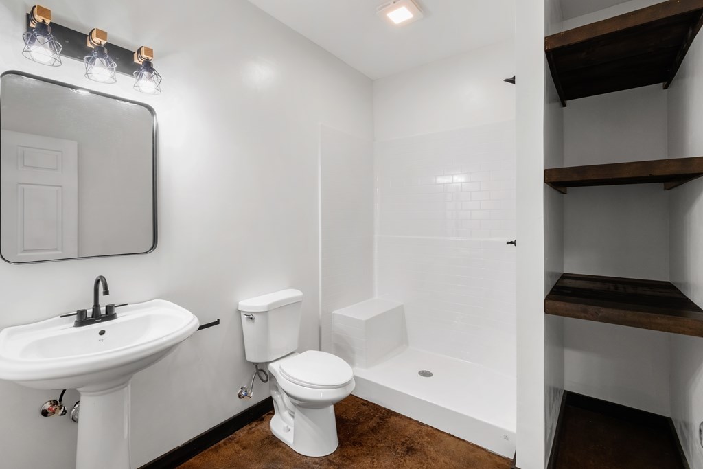 620 A Stiles Road Epworth, GA 30541 - Photo 14 of 21 a bathroom with a sink a toilet and shower