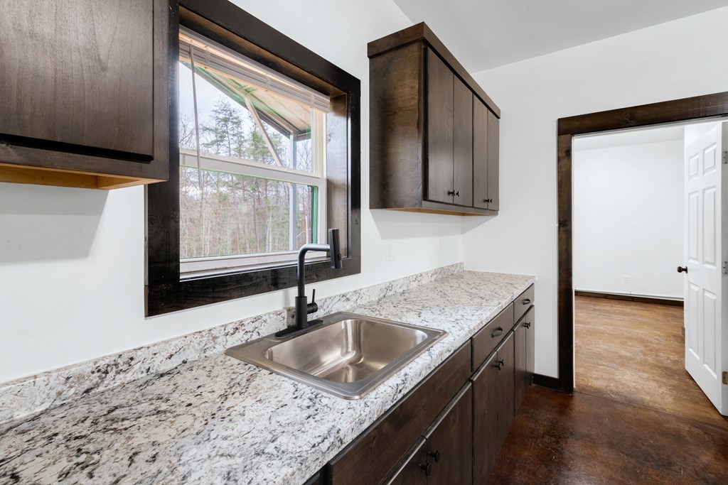 620 A Stiles Road Epworth, GA 30541 - Photo 17 of 21 a bathroom with a granite countertop sink and a window