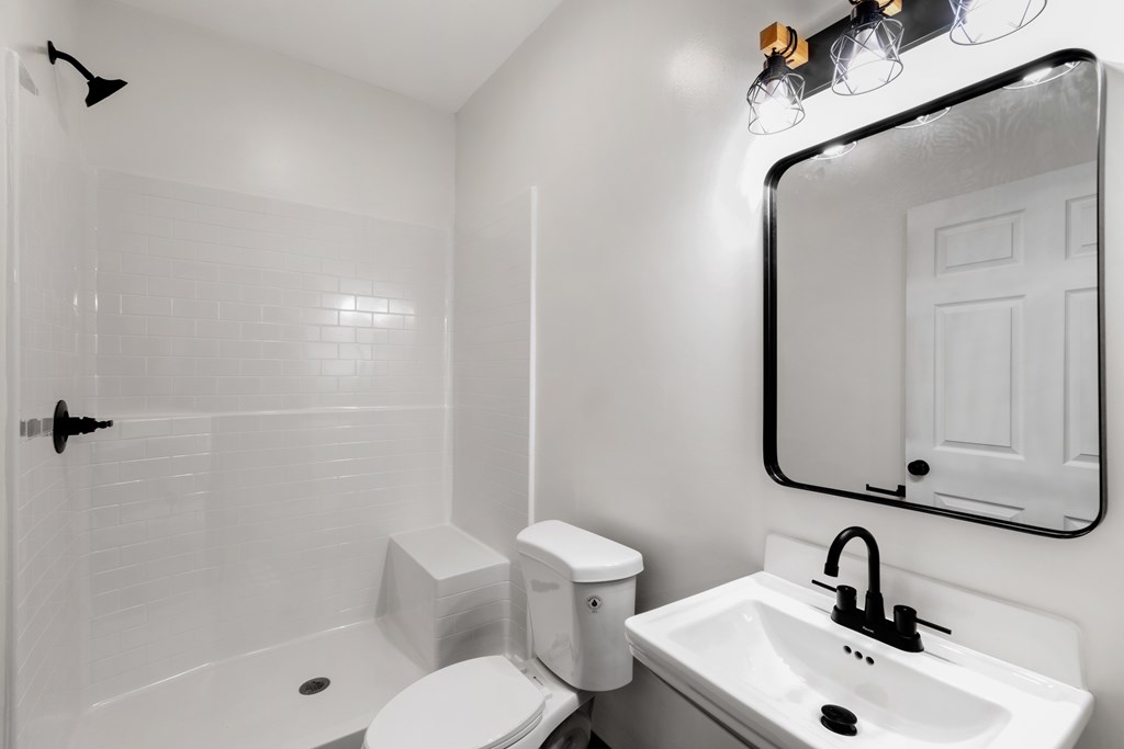 620 A Stiles Road Epworth, GA 30541 - Photo 10 of 21 a bathroom with a sink toilet and shower