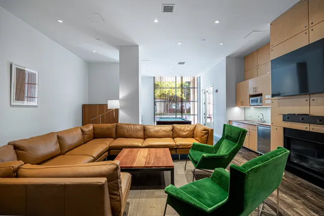 a living room with furniture fireplace and a flat screen tv
