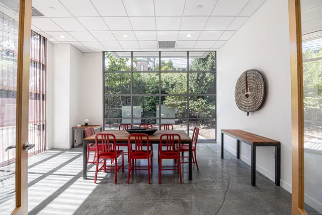 a view of a dining room with furniture window and outside view