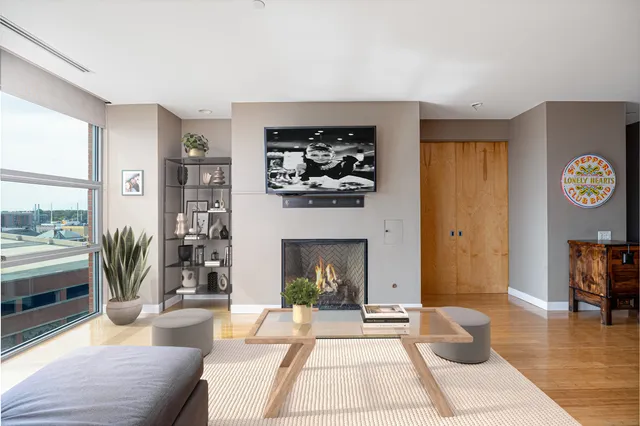 a living room with furniture and a fireplace
