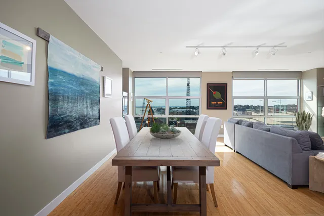 a view of a dining room with furniture window and wooden floor