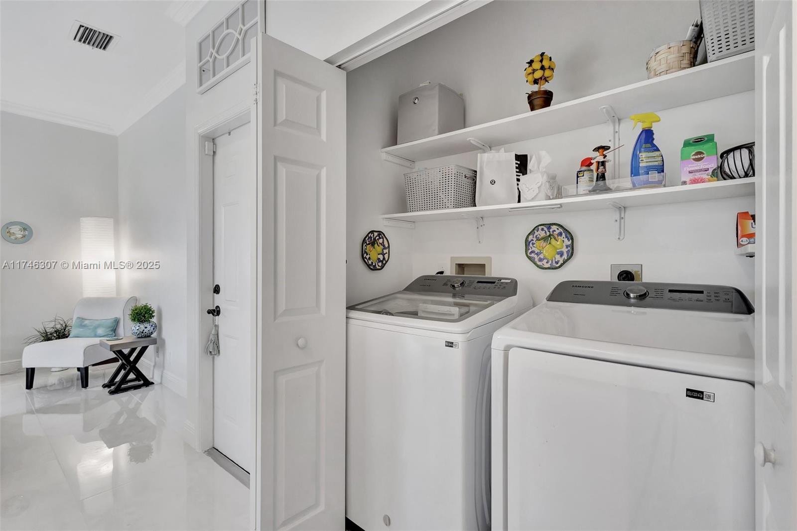 1826 Capeside Circle Wellington, FL 33414 - Photo 13 of 73 a utility room with dryer and washer