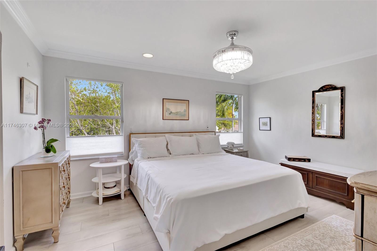 1826 Capeside Circle Wellington, FL 33414 - Photo 15 of 73 a bedroom with a bed and a window