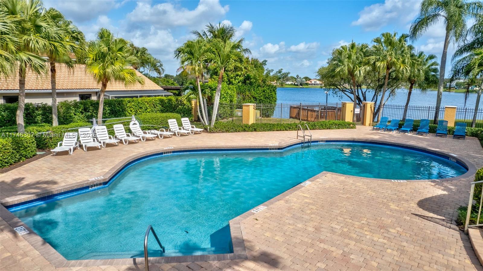 1826 Capeside Circle Wellington, FL 33414 - Photo 20 of 73 a view of a swimming pool with a yard