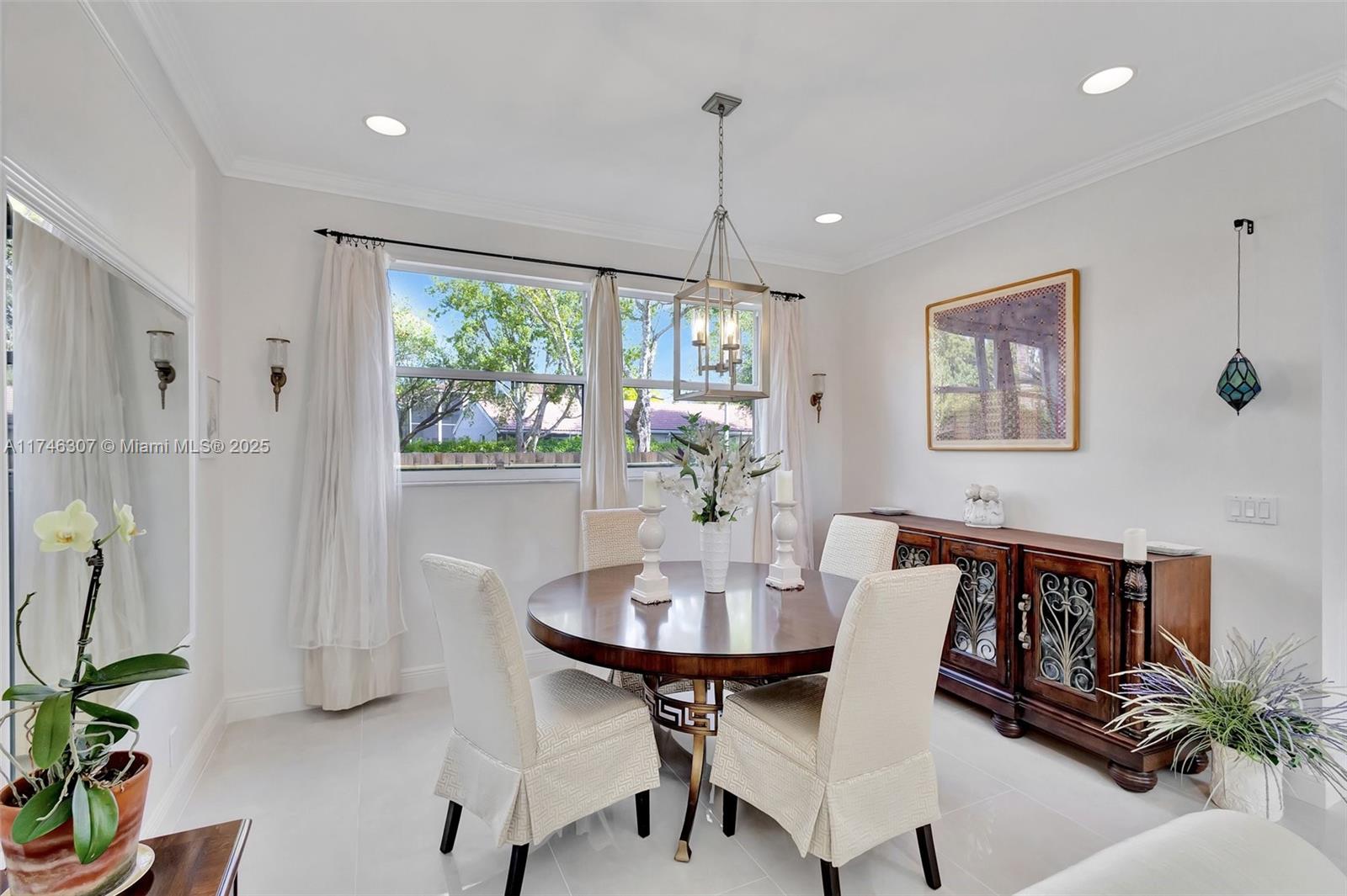 1826 Capeside Circle Wellington, FL 33414 - Photo 25 of 73 a view of a dining room with furniture window and outside view