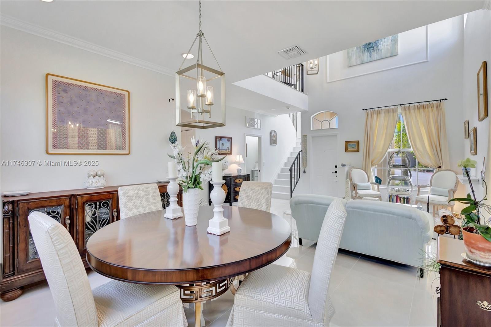 1826 Capeside Circle Wellington, FL 33414 - Photo 26 of 73 a view of a dining room with furniture and window