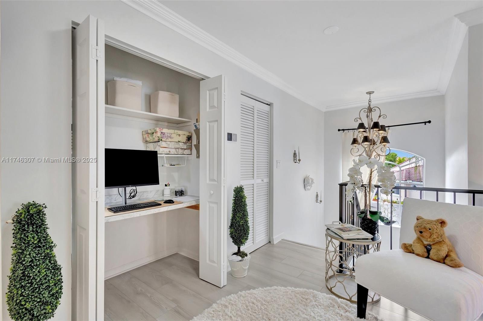 1826 Capeside Circle Wellington, FL 33414 - Photo 39 of 73 a living room with furniture a flat screen tv and a window