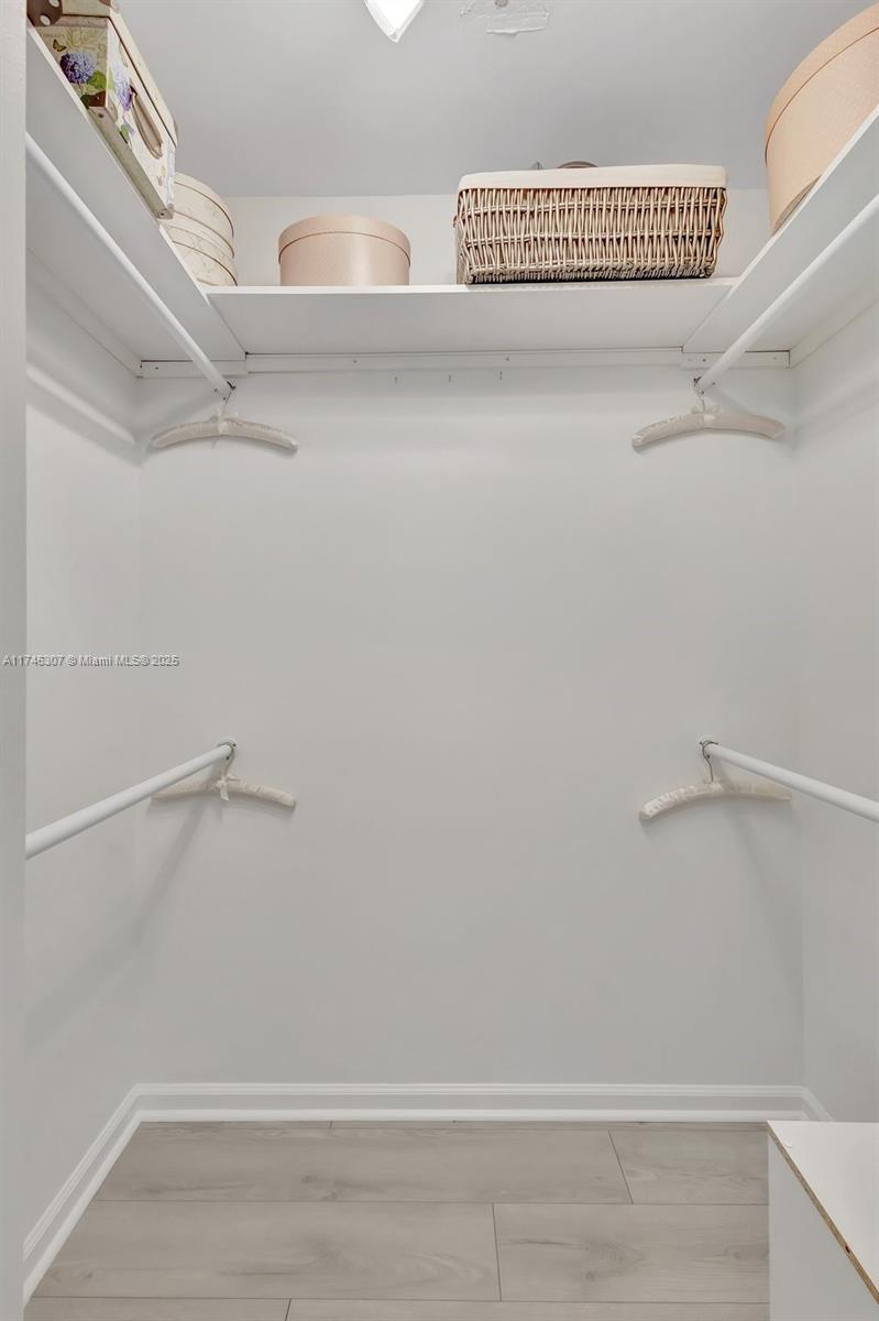 1826 Capeside Circle Wellington, FL 33414 - Photo 44 of 73 a view of a room with racks on the wall