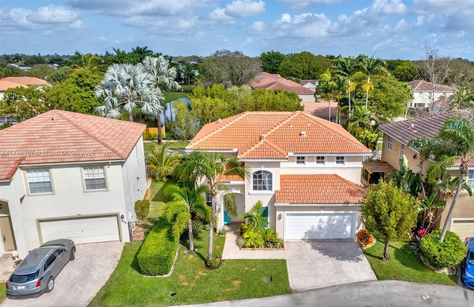 1826 Capeside Circle Wellington, FL 33414 - Photo 54 of 73 a aerial view of a house with garden space and street view
