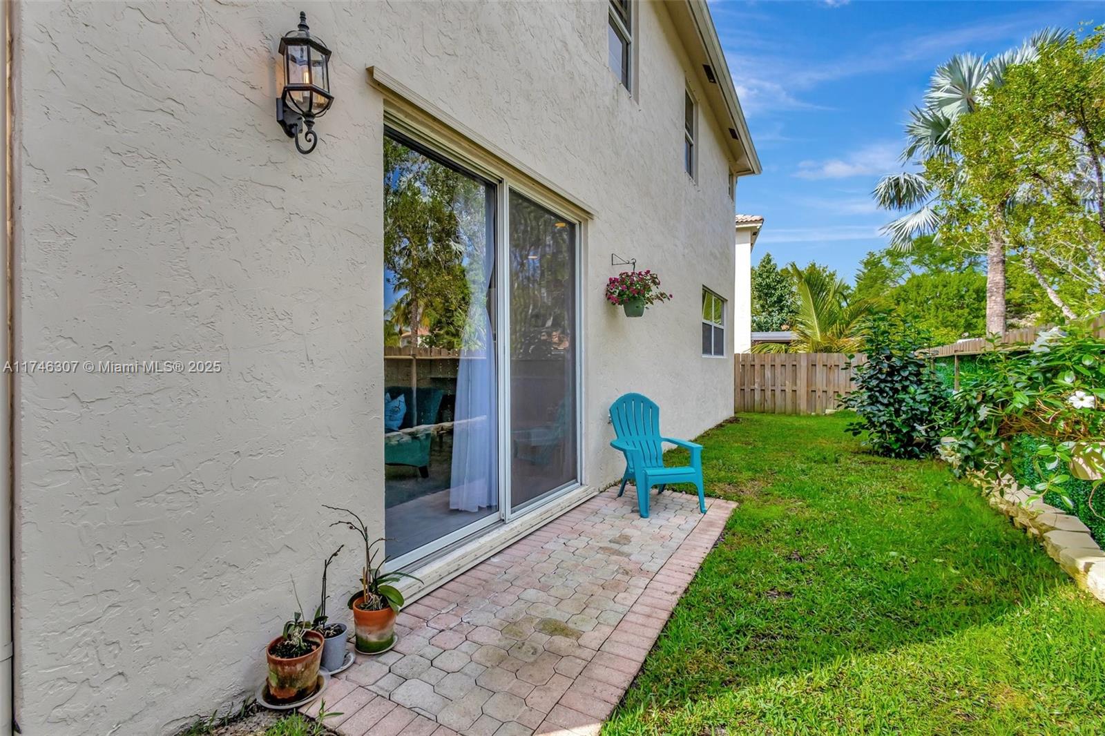 1826 Capeside Circle Wellington, FL 33414 - Photo 59 of 73 a view of a backyard with sitting area
