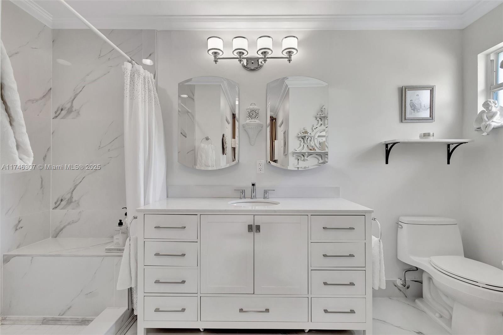 1826 Capeside Circle Wellington, FL 33414 - Photo 6 of 73 a bathroom with a granite countertop sink a toilet and a bathtub
