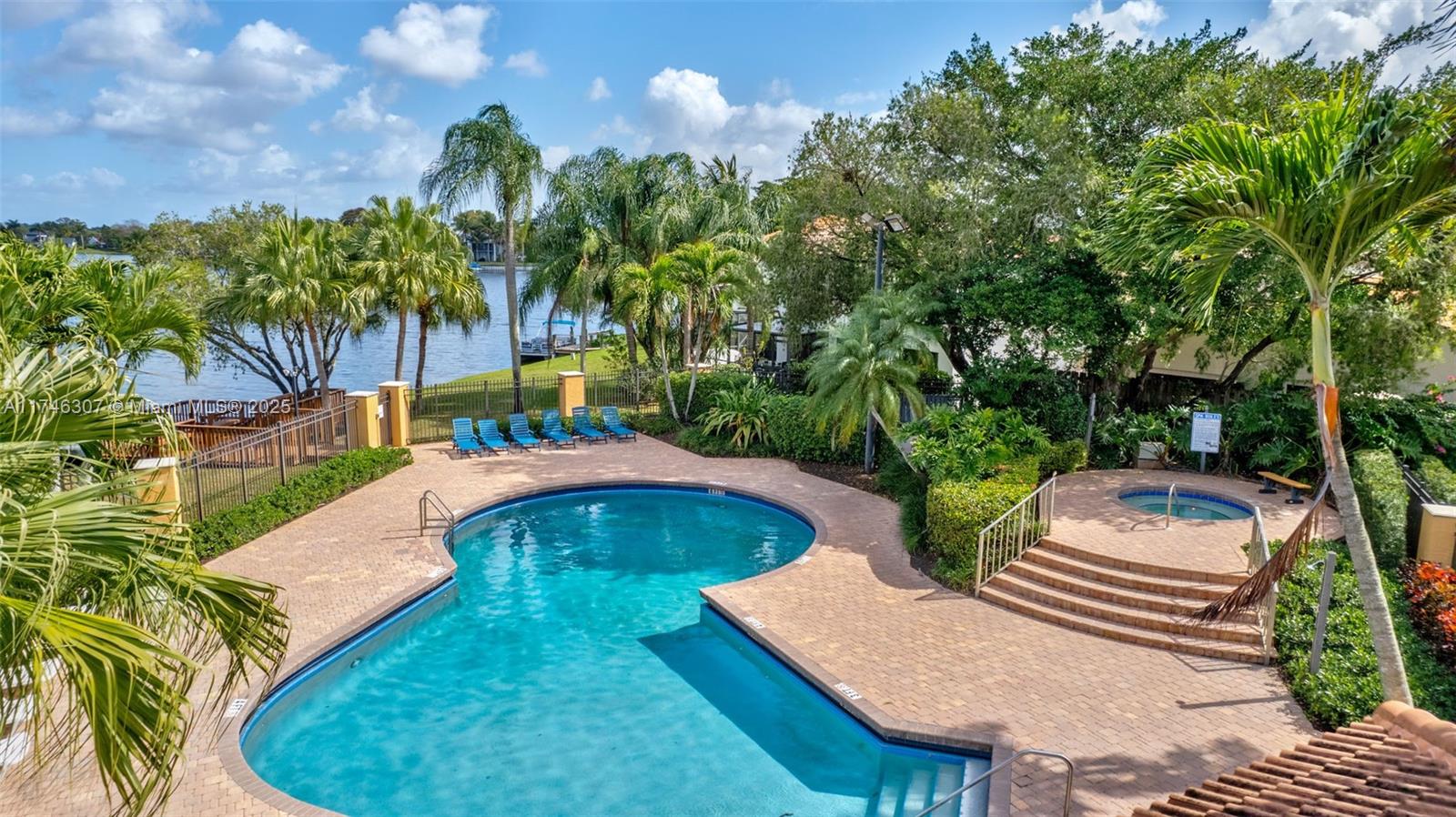 1826 Capeside Circle Wellington, FL 33414 - Photo 65 of 73 a view of swimming pool with a patio and a yard