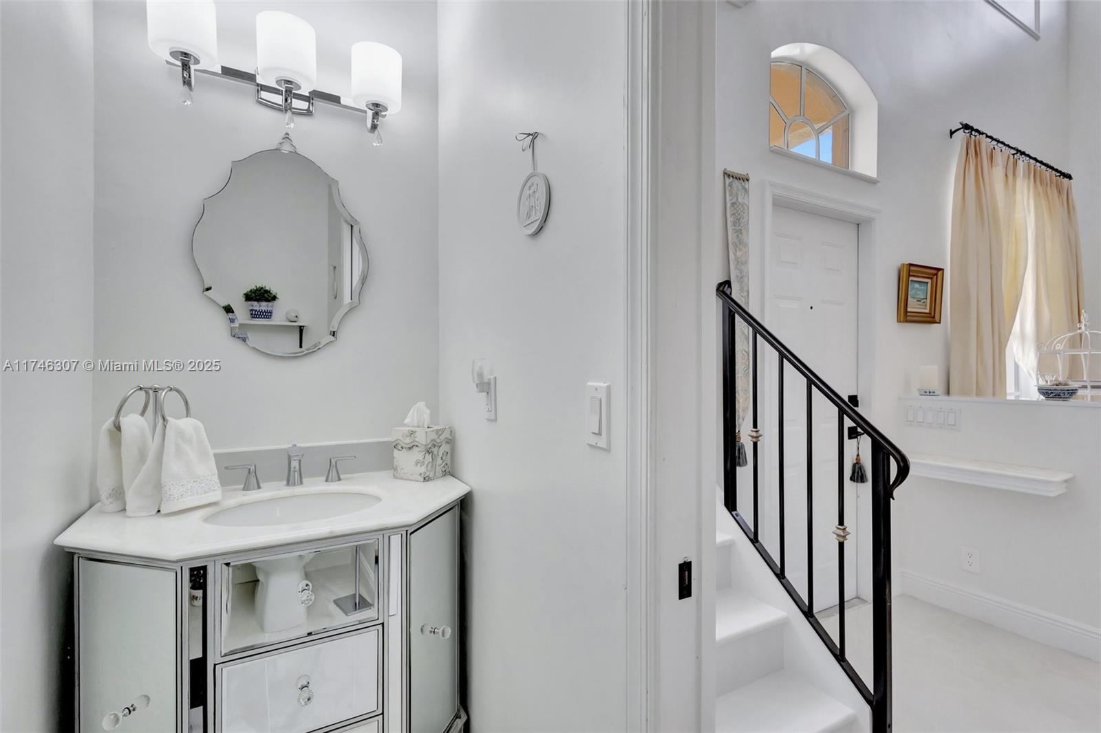 1826 Capeside Circle Wellington, FL 33414 - Photo 10 of 73 a bathroom with a sink and a mirror