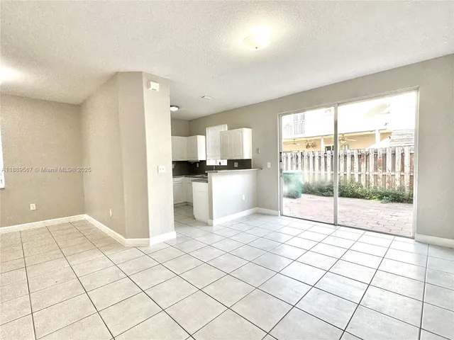 a view of a kitchen with windows