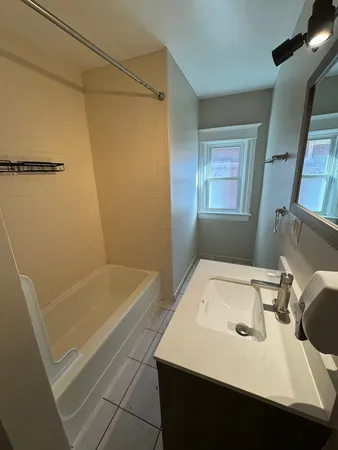 a bathroom with a sink and a tub