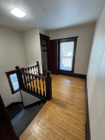 a view of entryway with wooden floor