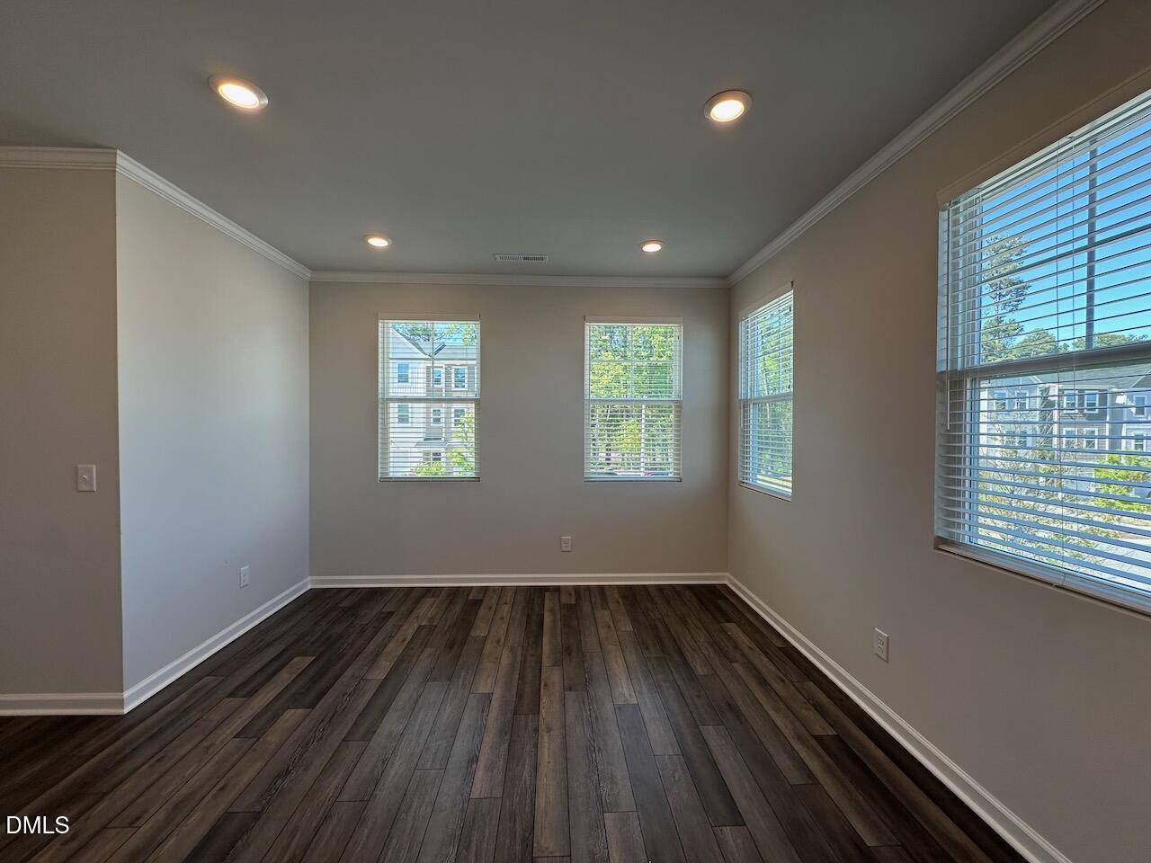 2521 Laurel Valley Way Raleigh, NC 27604 - Photo 11 of 25 an empty room with wooden floor and windows