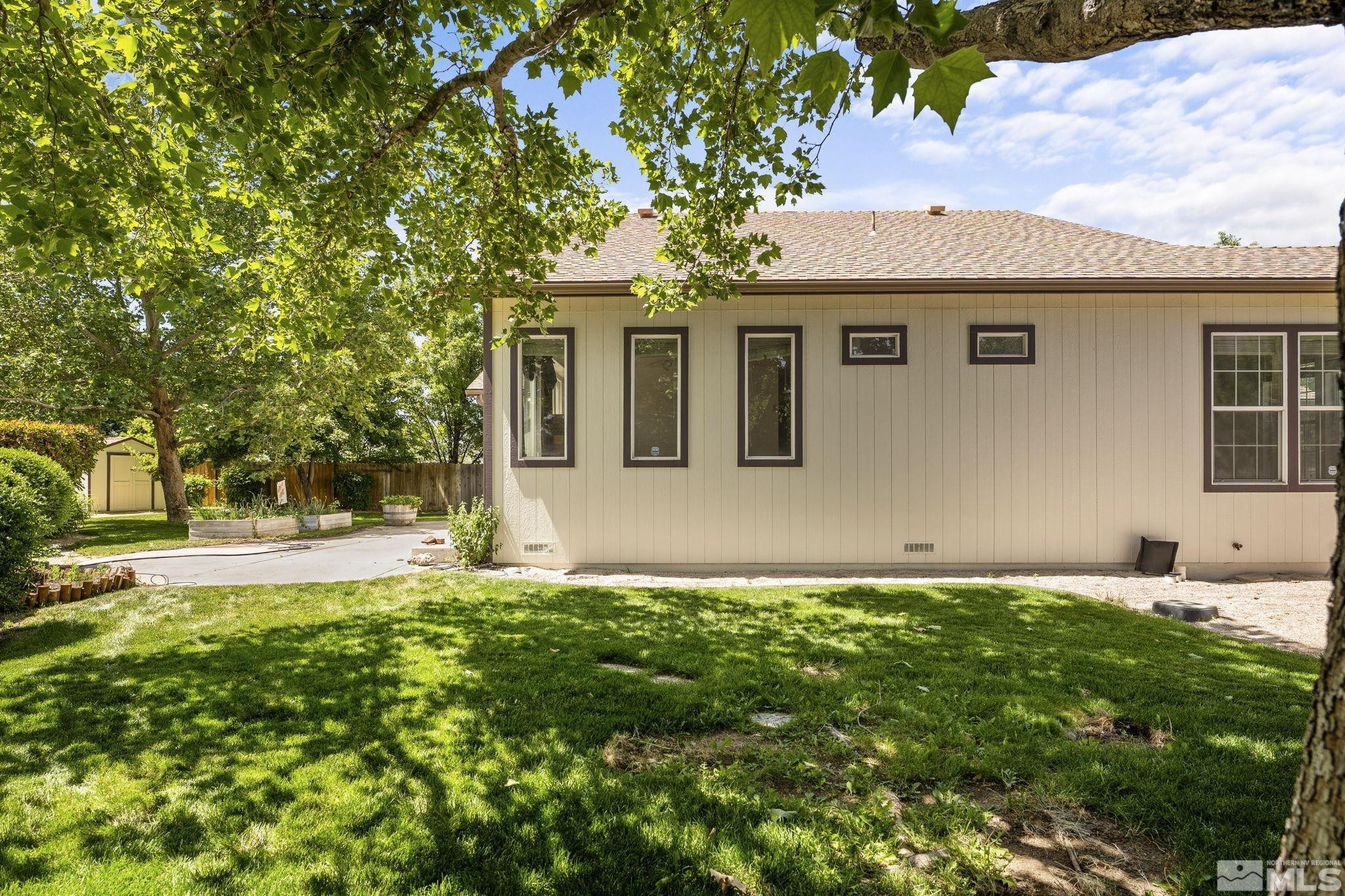 1442 Wessex Circle Reno, NV 89503 - Photo 30 of 32 a front view of a house with a yard