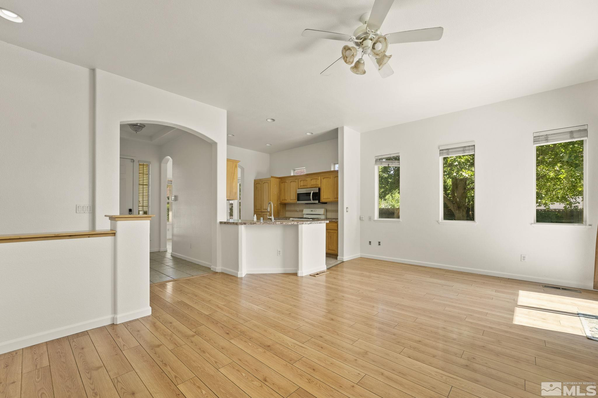 1442 Wessex Circle Reno, NV 89503 - Photo 7 of 32 a view of a kitchen with wooden floor and a kitchen