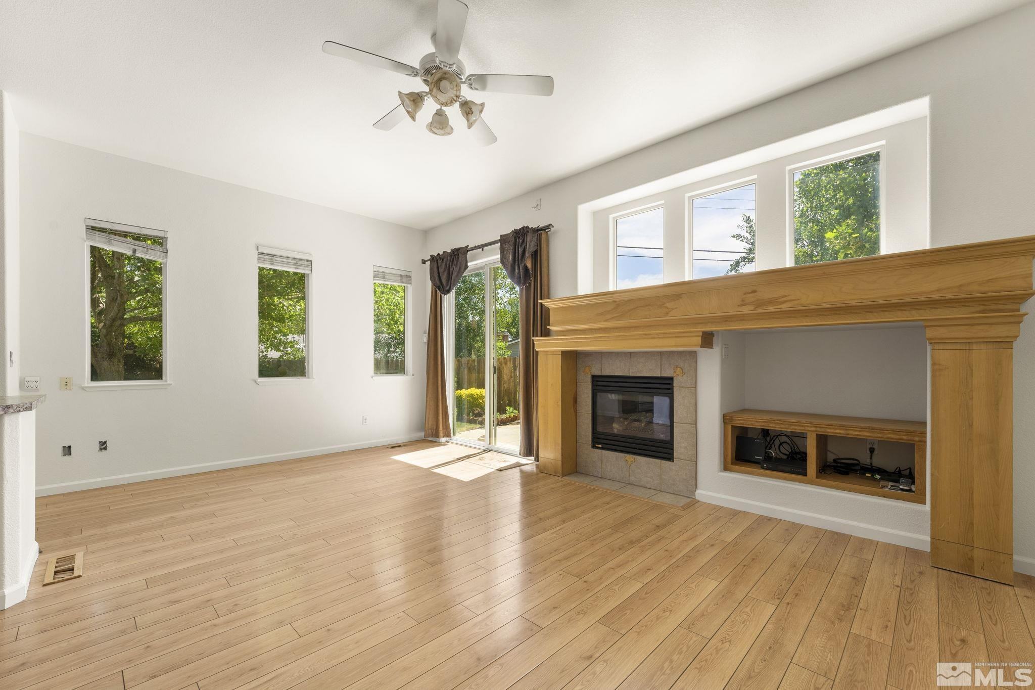 1442 Wessex Circle Reno, NV 89503 - Photo 8 of 32 a view of an empty room with window and fire place