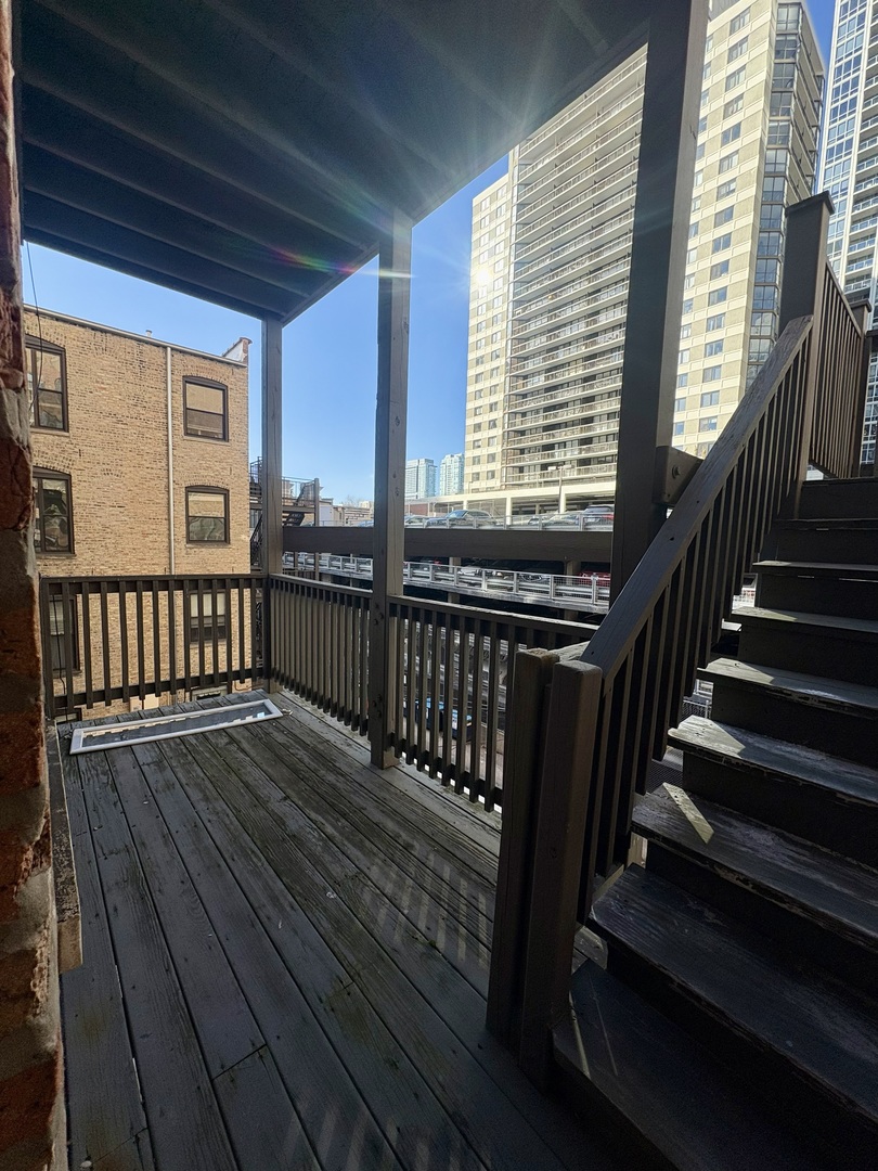 12 West Chestnut Street, Unit 3 Chicago, IL 60610 - Photo 19 of 20 a view of balcony with wooden floor