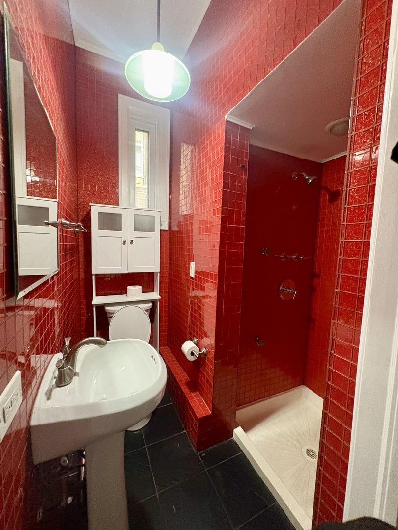 12 West Chestnut Street, Unit 3 Chicago, IL 60610 - Photo 10 of 20 a bathroom with a sink and a mirror