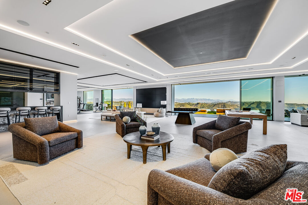 2078 Stradella Road Los Angeles, CA 90077 - Photo 23 of 37 a living room with furniture and a flat screen tv