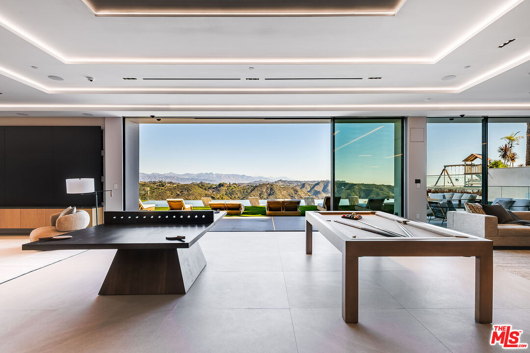 2078 Stradella Road Los Angeles, CA 90077 - Photo 25 of 37 a view of living room with furniture and floor to ceiling window