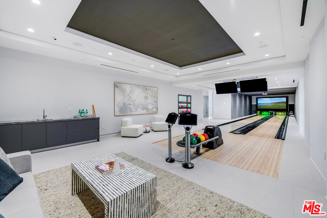 2078 Stradella Road Los Angeles, CA 90077 - Photo 29 of 37 a living room with furniture and a flat screen tv