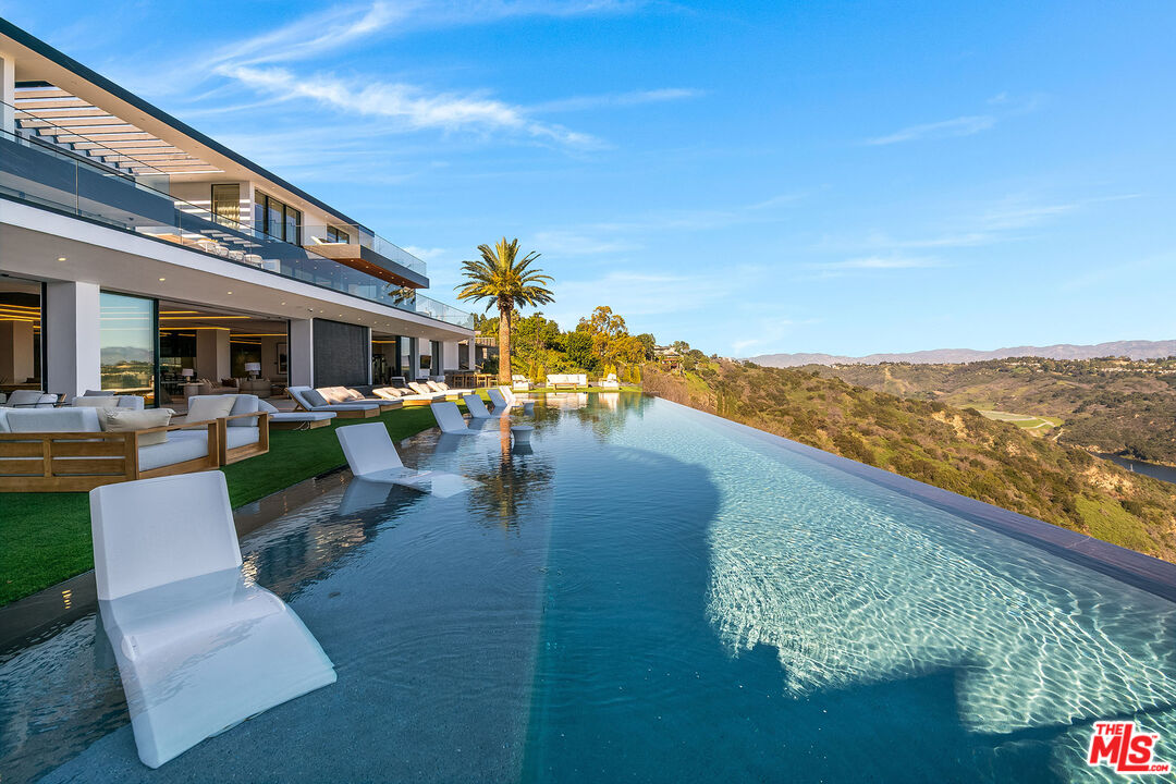 2078 Stradella Road Los Angeles, CA 90077 - Photo 32 of 37 a view of a swimming pool with a patio