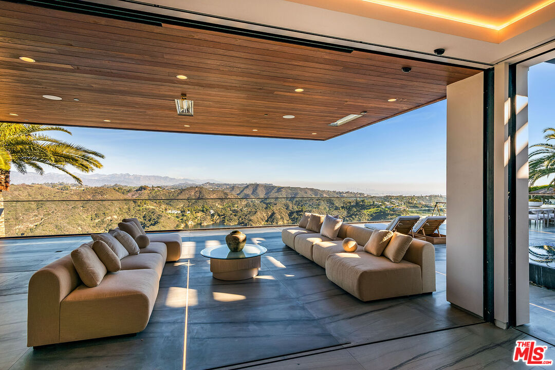 2078 Stradella Road Los Angeles, CA 90077 - Photo 7 of 37 a view of roof deck with couches and city view