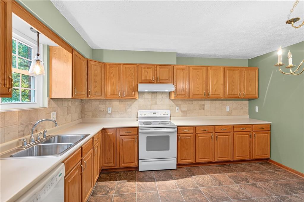 2902 Darlington Road, Unit 703 Beaver Falls, PA 15010 - Photo 15 of 37 a kitchen with stainless steel appliances granite countertop a sink stove and refrigerator