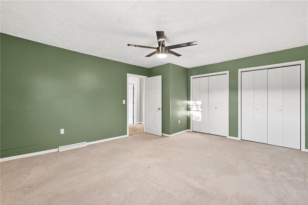 2902 Darlington Road, Unit 703 Beaver Falls, PA 15010 - Photo 29 of 37 an empty room with closet and a ceiling fan