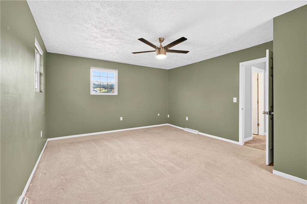 2902 Darlington Road, Unit 703 Beaver Falls, PA 15010 - Photo 30 of 37 an empty room with a ceiling fan and a window