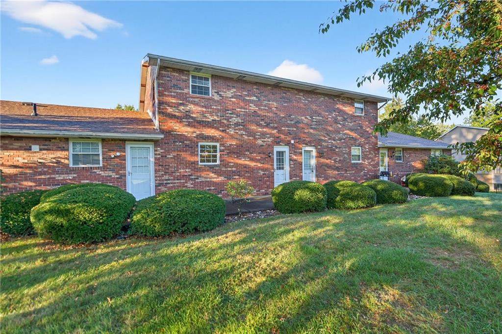 2902 Darlington Road, Unit 703 Beaver Falls, PA 15010 - Photo 7 of 37 a brick building with a yard