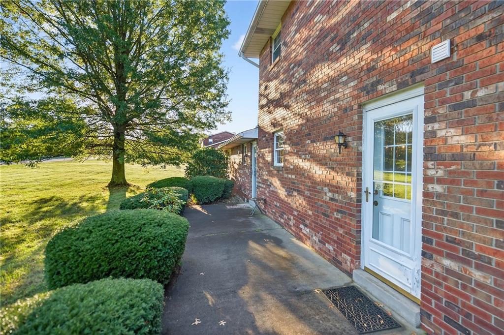 2902 Darlington Road, Unit 703 Beaver Falls, PA 15010 - Photo 8 of 37 a view of a yard with plants and large trees