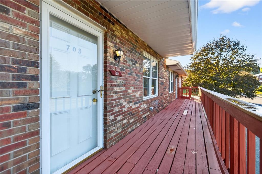 2902 Darlington Road, Unit 703 Beaver Falls, PA 15010 - Photo 10 of 37 a balcony with wooden floor and city view