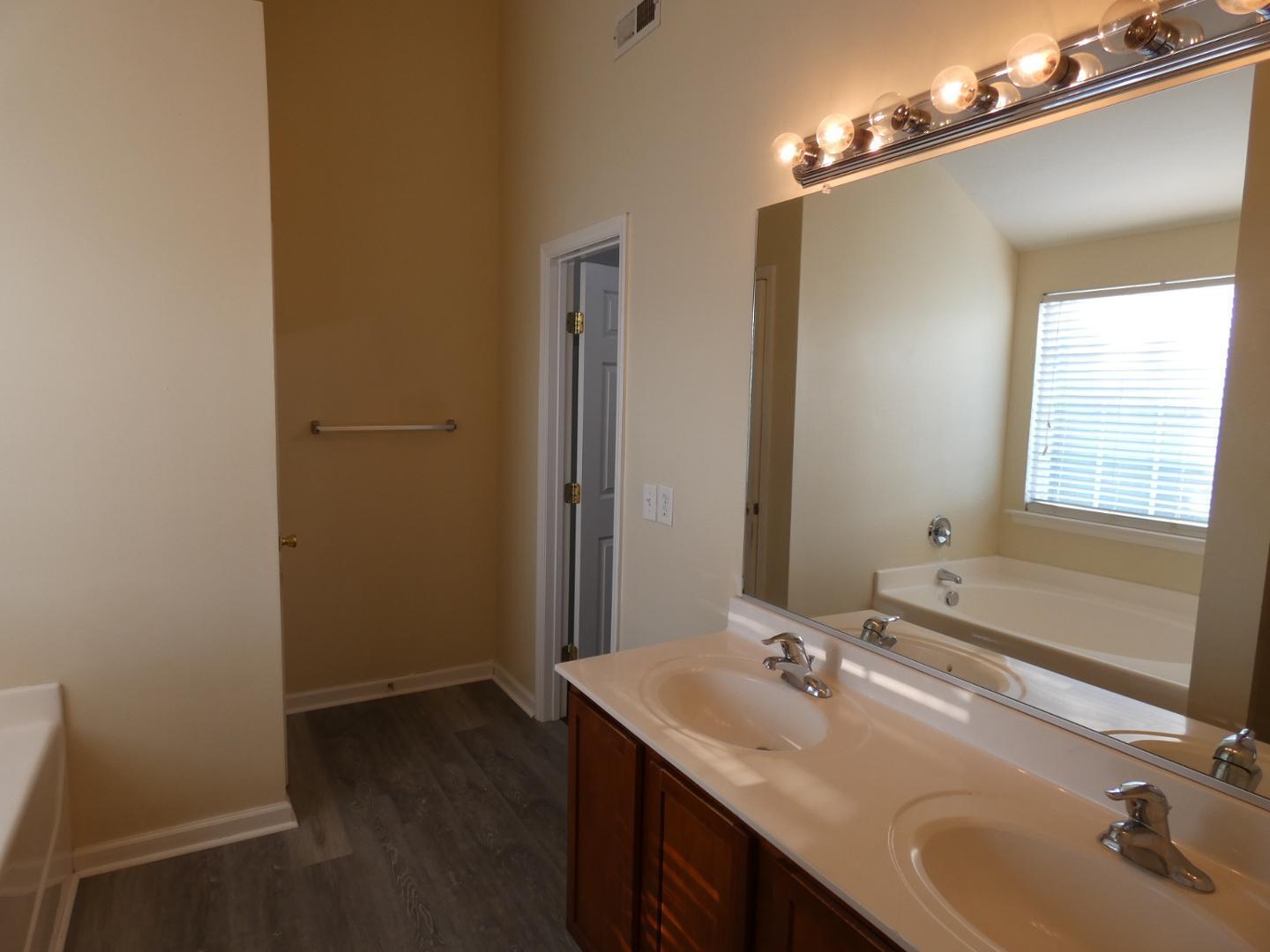 1624 Brown Owl Drive Raleigh, NC 27610 - Photo 13 of 22 a bathroom with a sink and a mirror