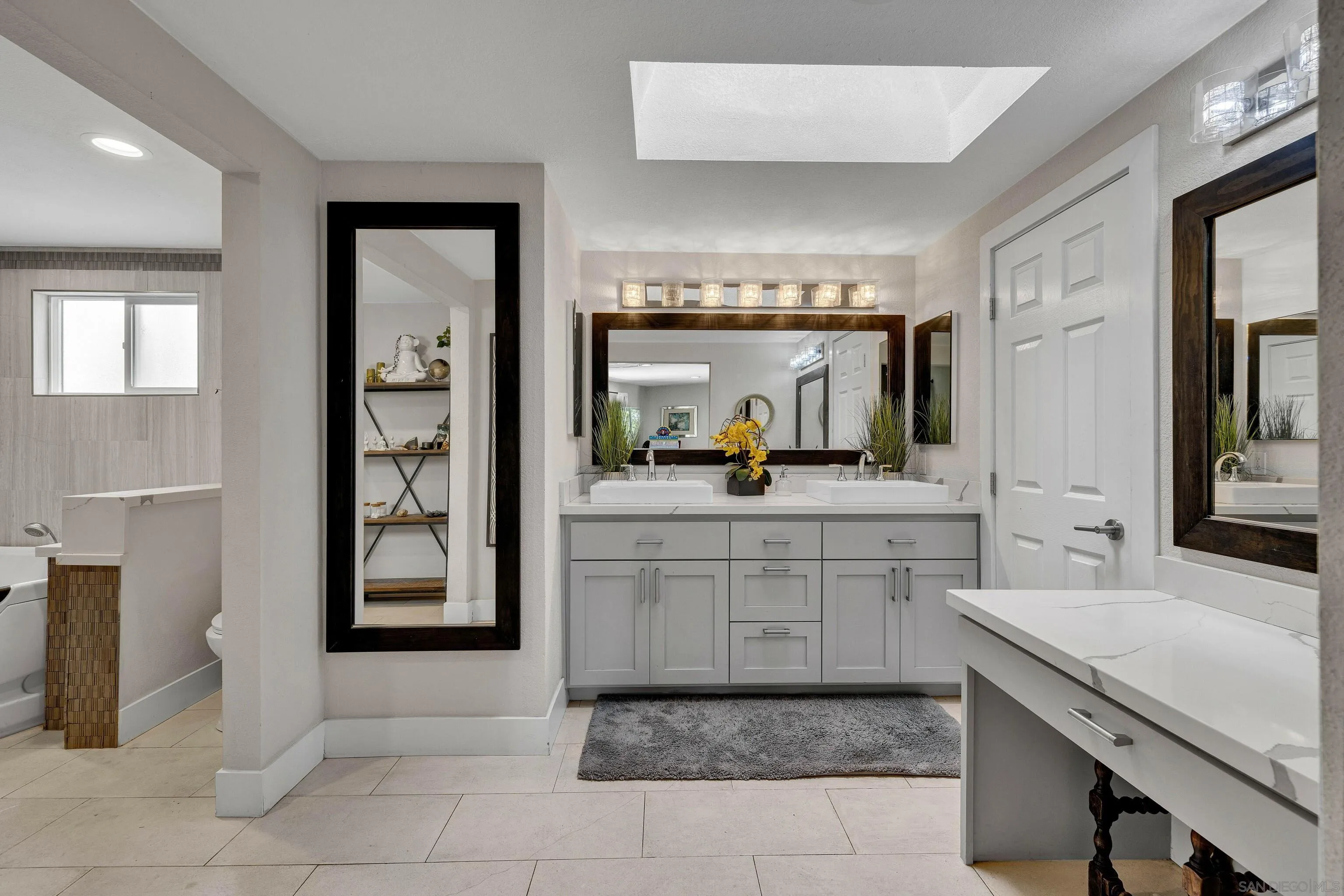 37389 Ave Chapala Temecula, CA 92592 - Photo 18 of 68 a bathroom with a sink a vanity and a mirror