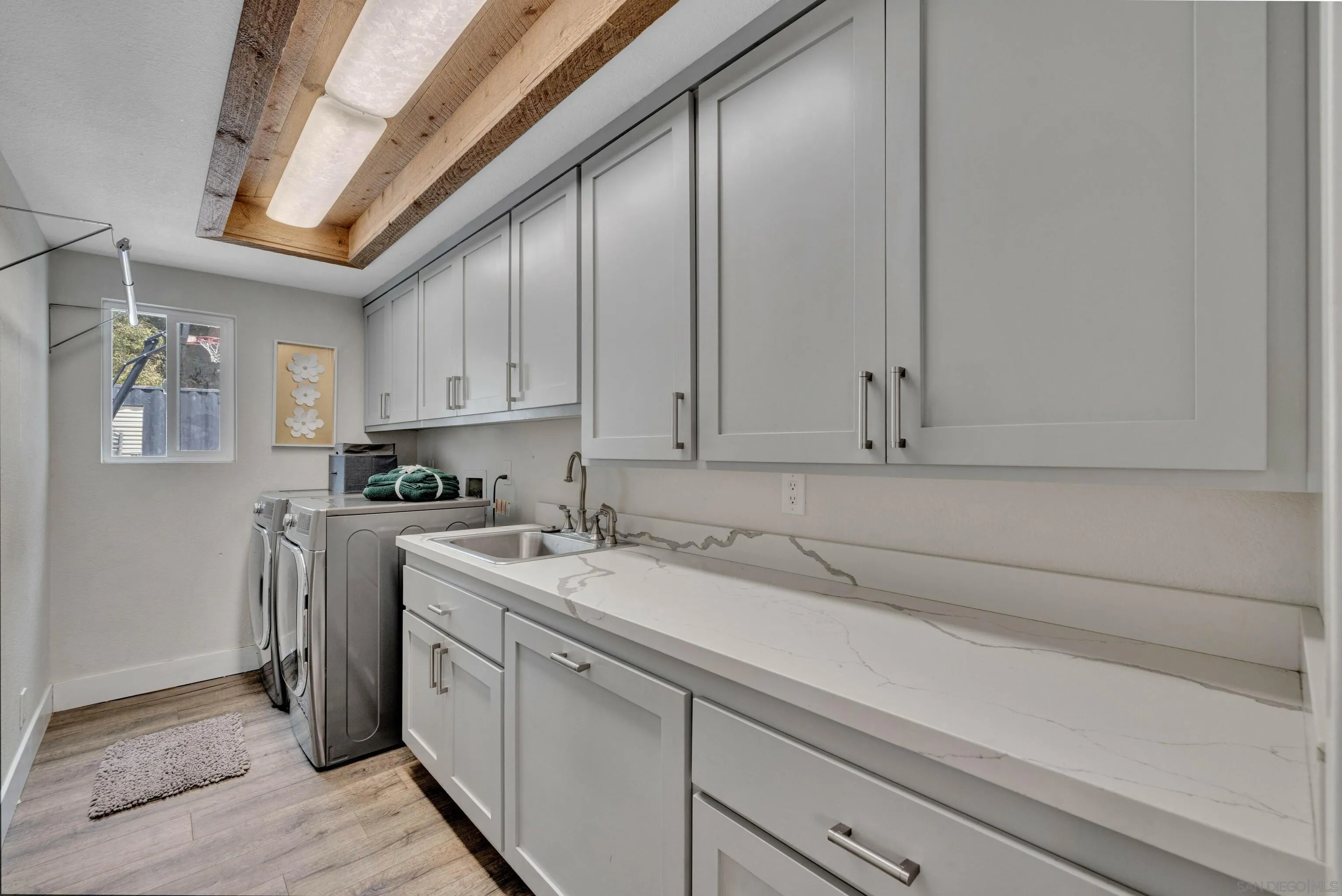 37389 Ave Chapala Temecula, CA 92592 - Photo 26 of 68 a kitchen with a sink and cabinets