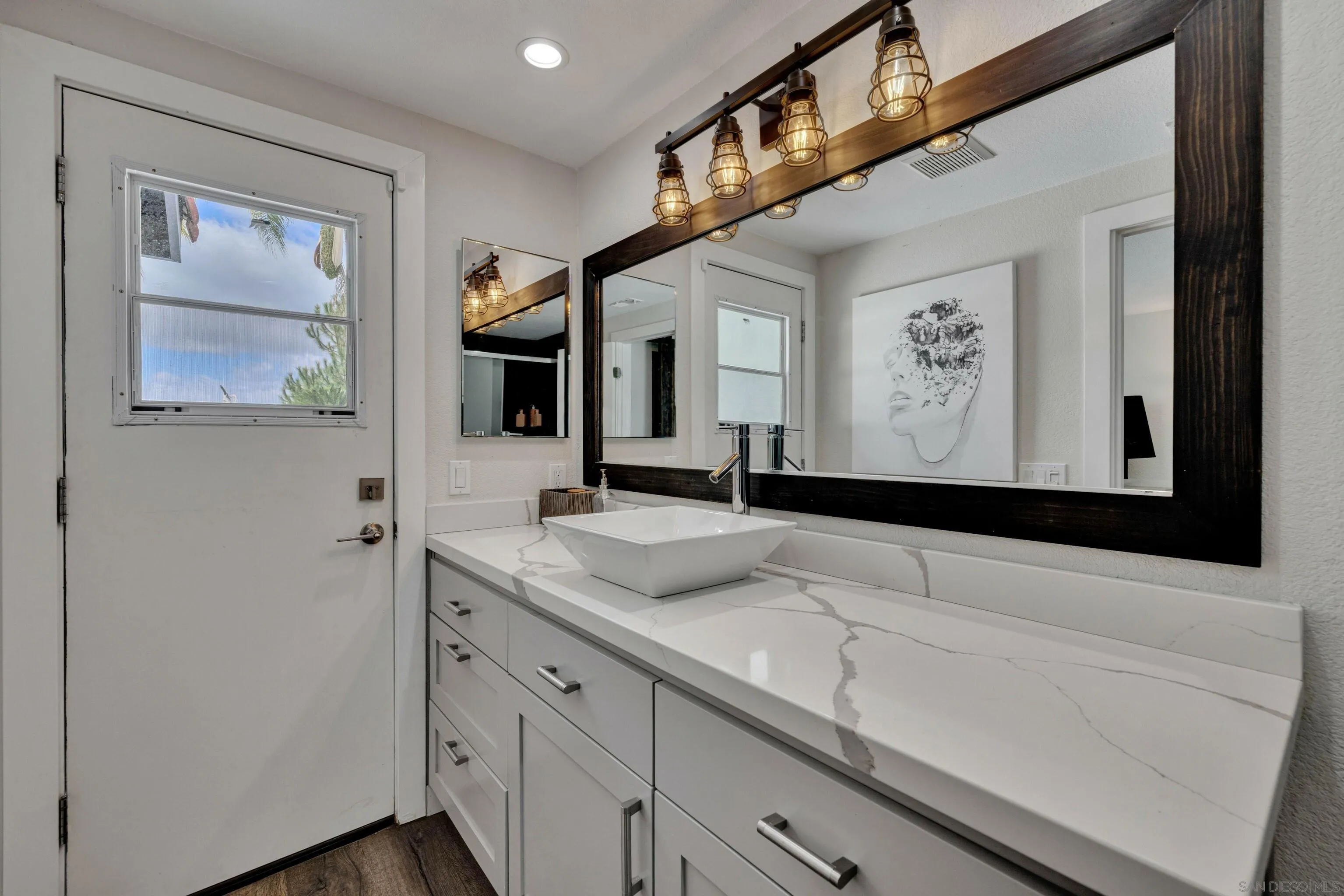37389 Ave Chapala Temecula, CA 92592 - Photo 29 of 68 a bathroom with a sink and a mirror