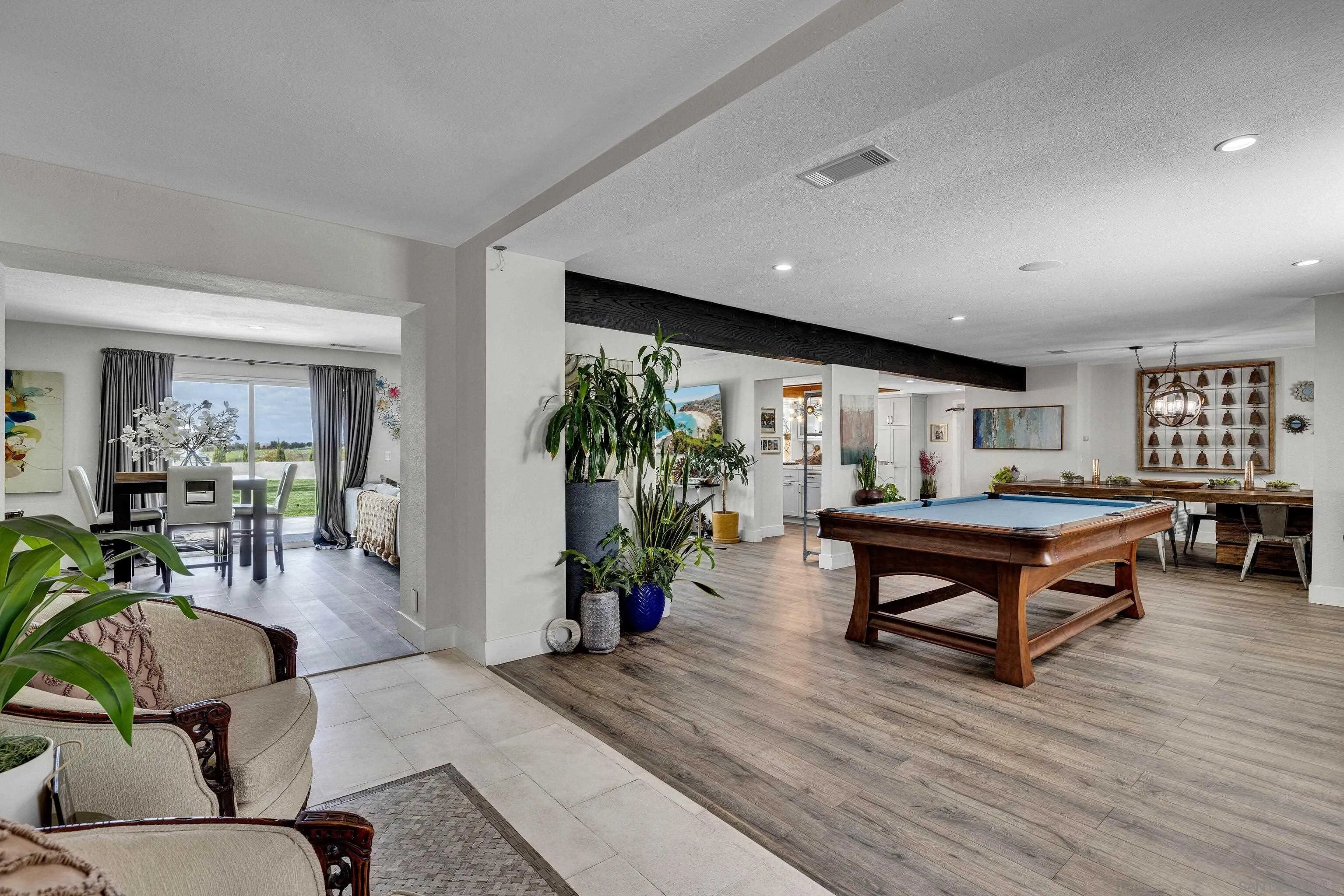 37389 Ave Chapala Temecula, CA 92592 - Photo 4 of 68 a living room with furniture a table and wooden floor
