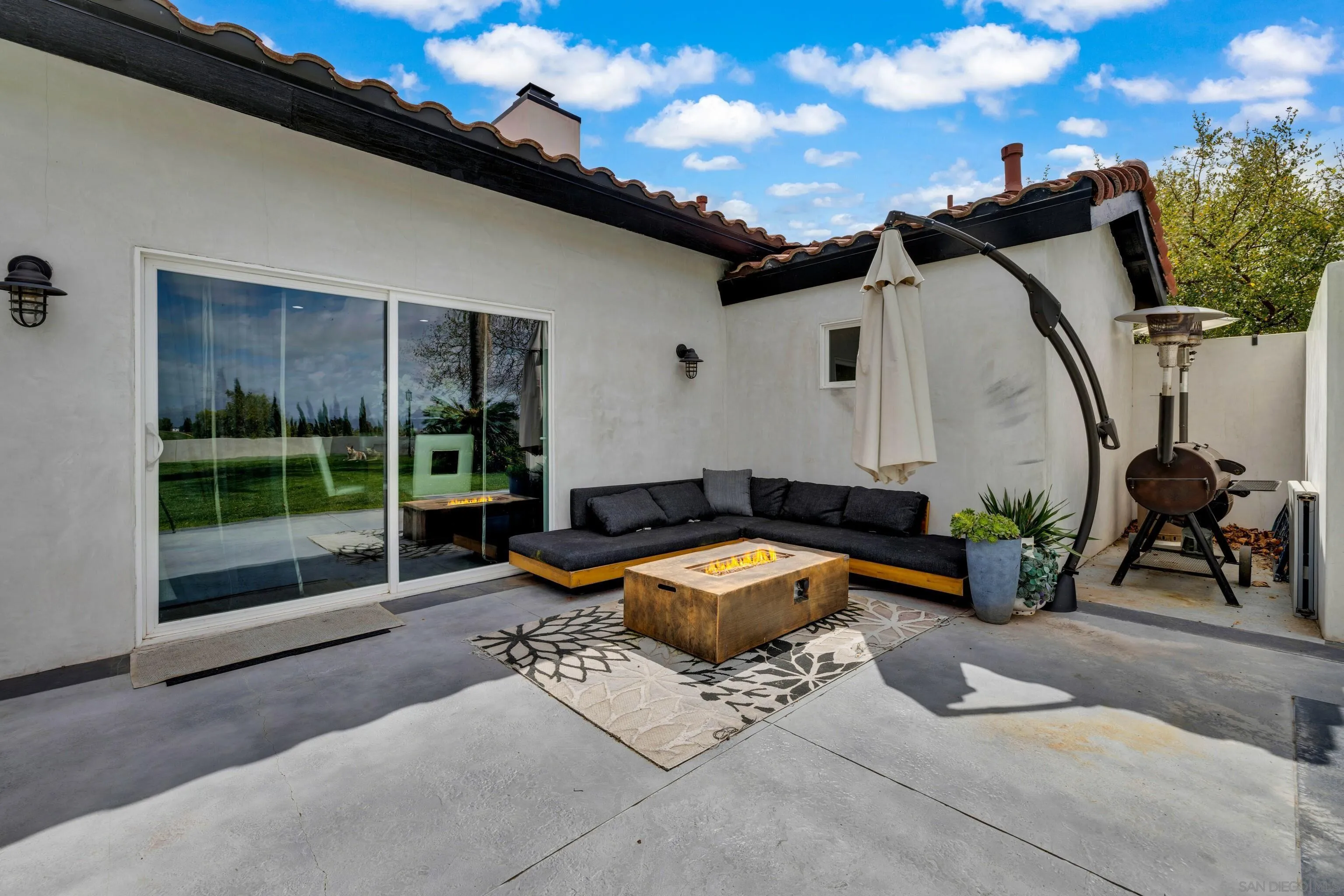 37389 Ave Chapala Temecula, CA 92592 - Photo 46 of 68 a building outdoor space with patio furniture and potted plants
