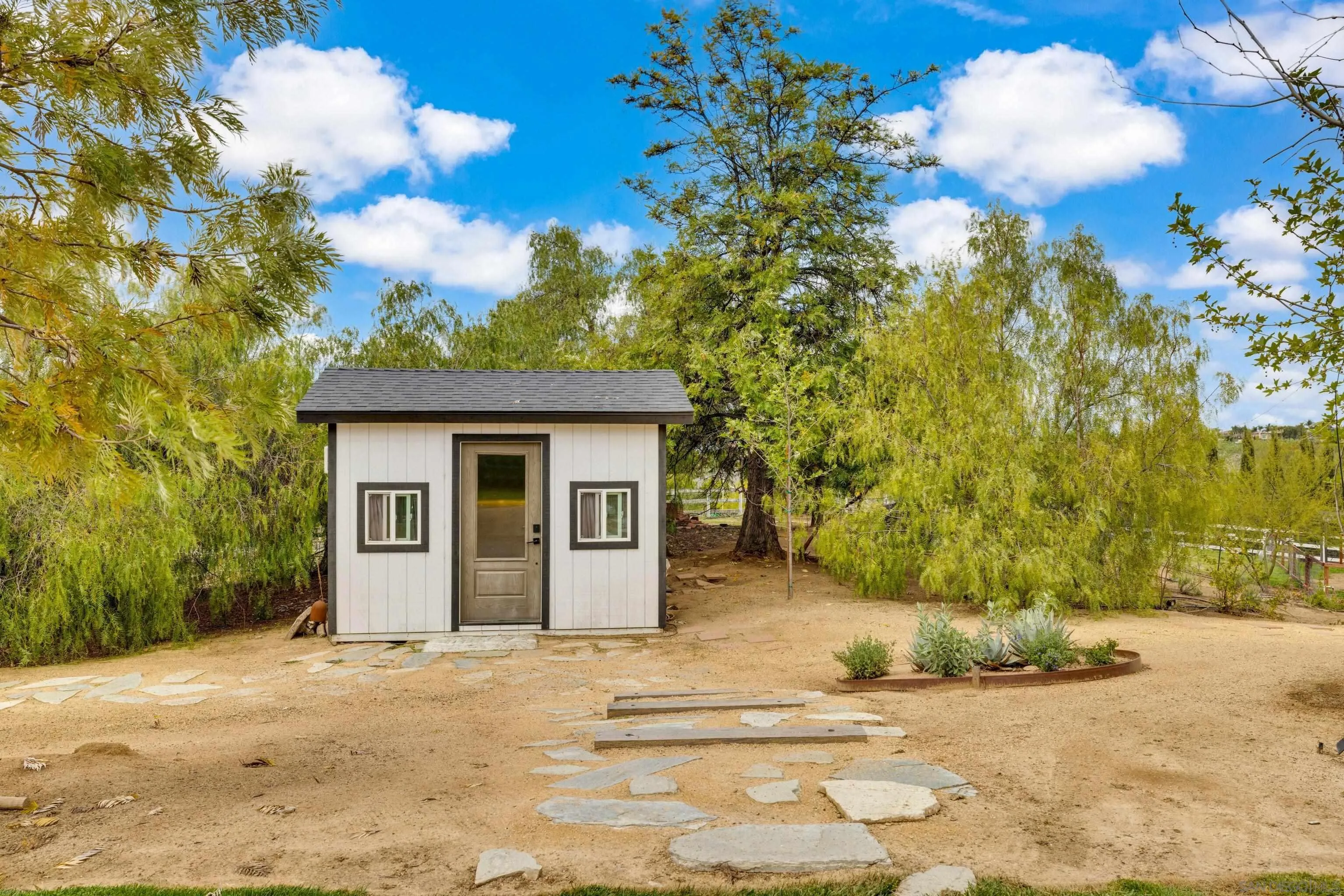 37389 Ave Chapala Temecula, CA 92592 - Photo 49 of 68 a view of a house with a tree in front of it