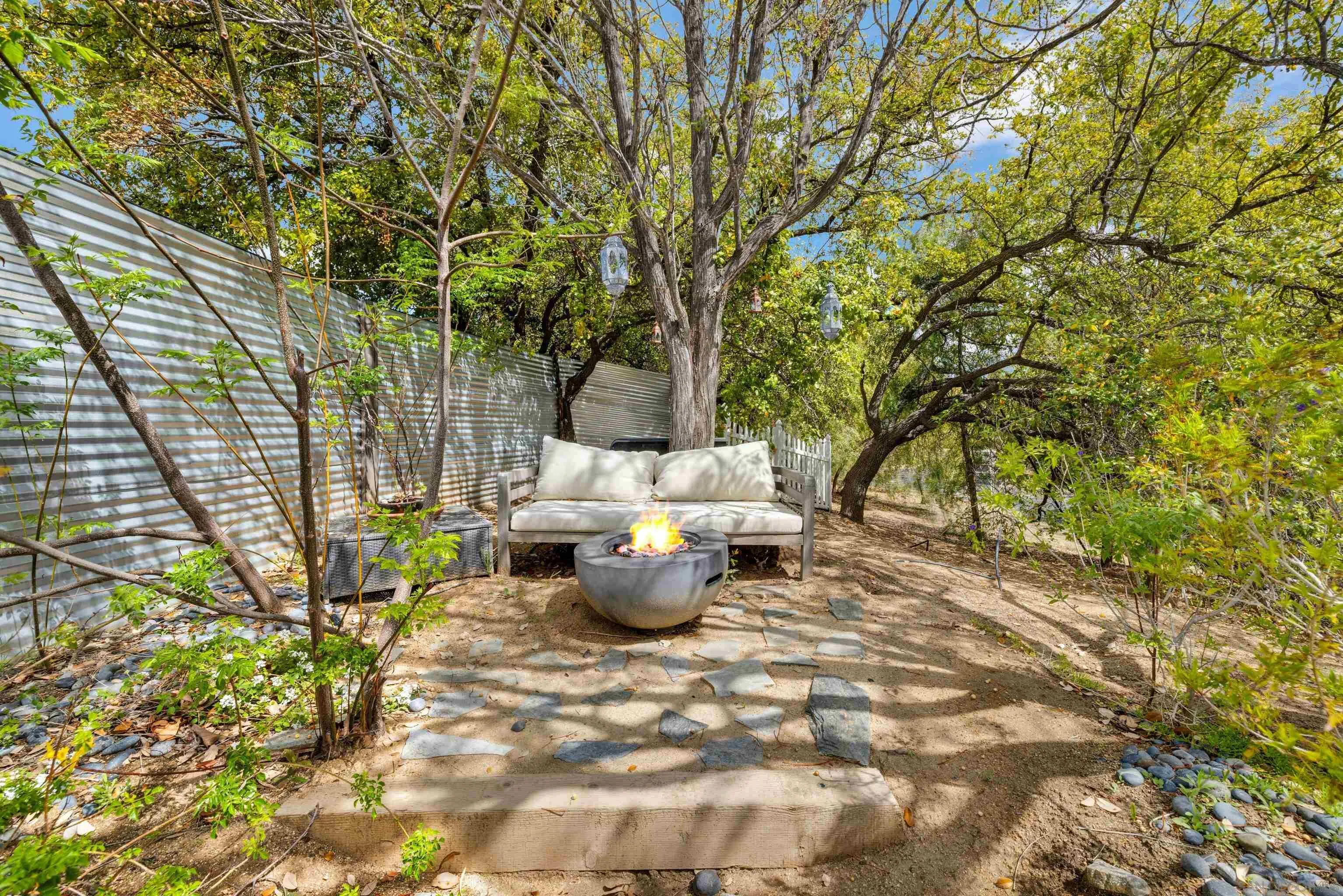 37389 Ave Chapala Temecula, CA 92592 - Photo 68 of 68 a view of a backyard with table and chairs